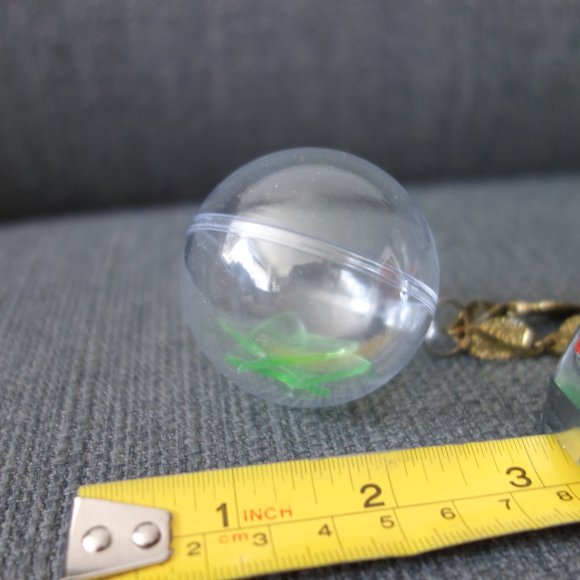 Broken Uranium Glass Inside Plastic Ornament with Metal Necklace - Picture 9 of 10